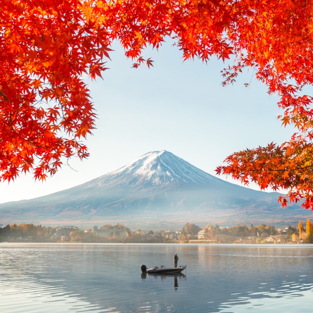 Colorful Autumn Season and Mountain Fuji with morning fog and red leaves at lake Kawaguchiko