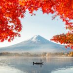 Colorful Autumn Season and Mountain Fuji with morning fog and red leaves at lake Kawaguchiko